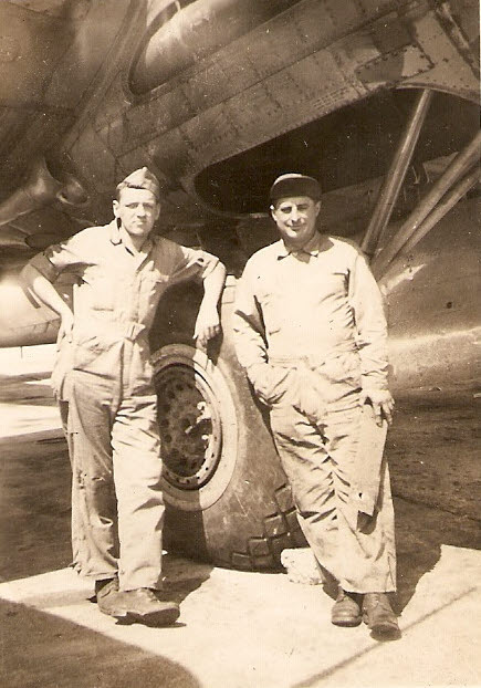 D.G. and Oscar in front of B-17 main wheel 