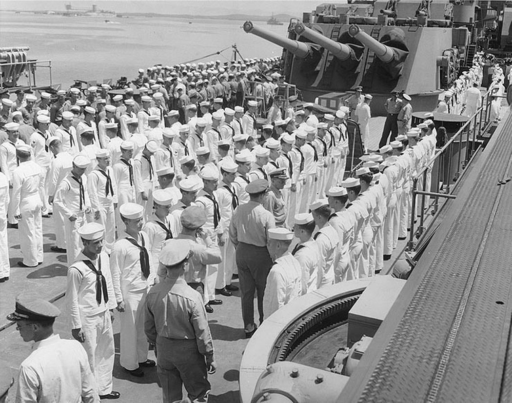 Captain inspecting crew, USS Oregon City (CA-122), 1946 
