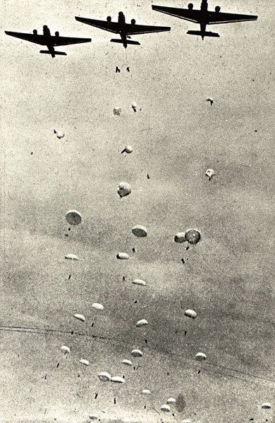 A Ju-52 dropping paratroopers during the invasion of Crete