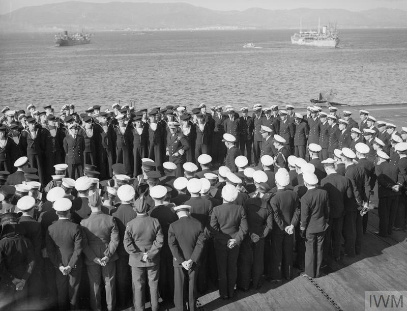 Admiral Burroughs congratulating crew of HMS Pursuer