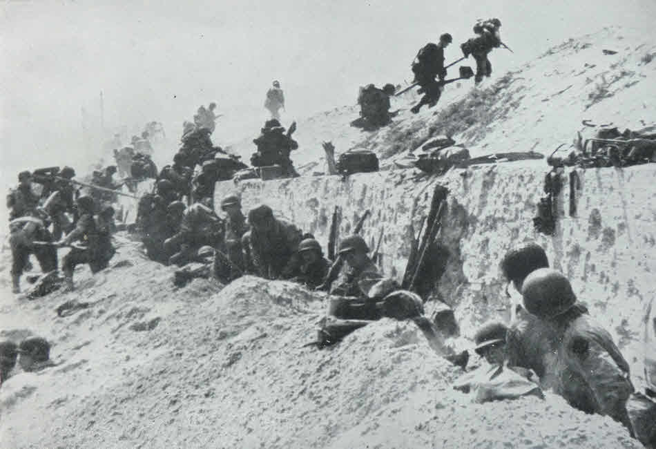 US troops crossing the Sea Wall at Utah Beach 