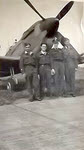 Pilots under nose of No.322 Squadron Spitfire 