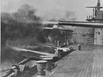 USS Kansas (BB-21) fires guns, 1910 