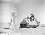 Bren Gun Carrier passing Italian monument, Sidi Barrani 