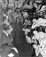 Evacuees returning home, HMS Empress, 1944 
